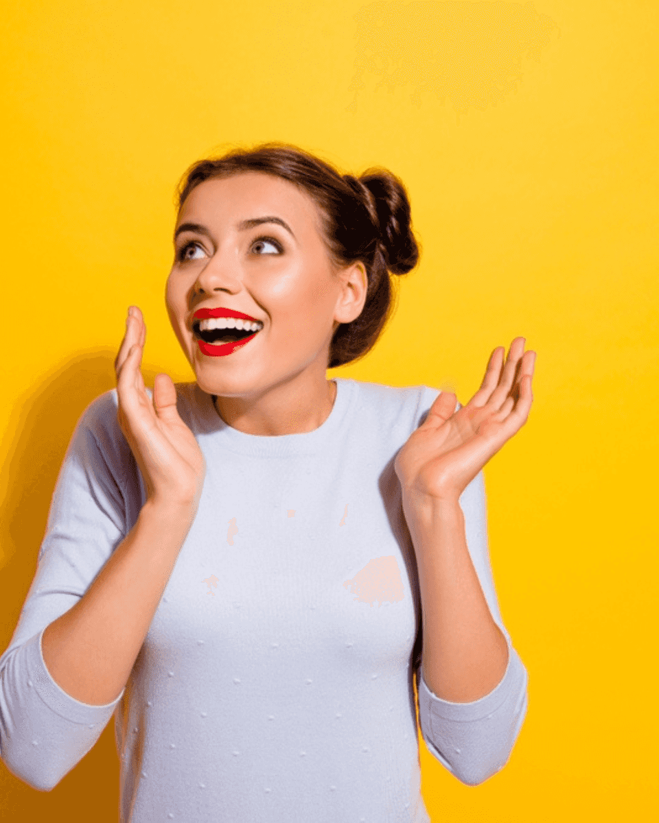 Woman looking up excitedly