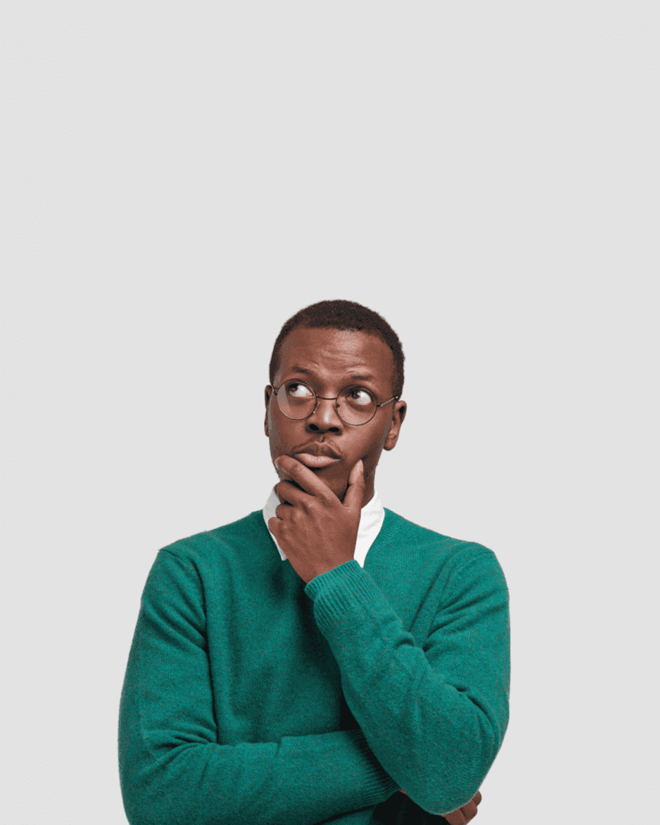 Man in a green sweater deep in thought