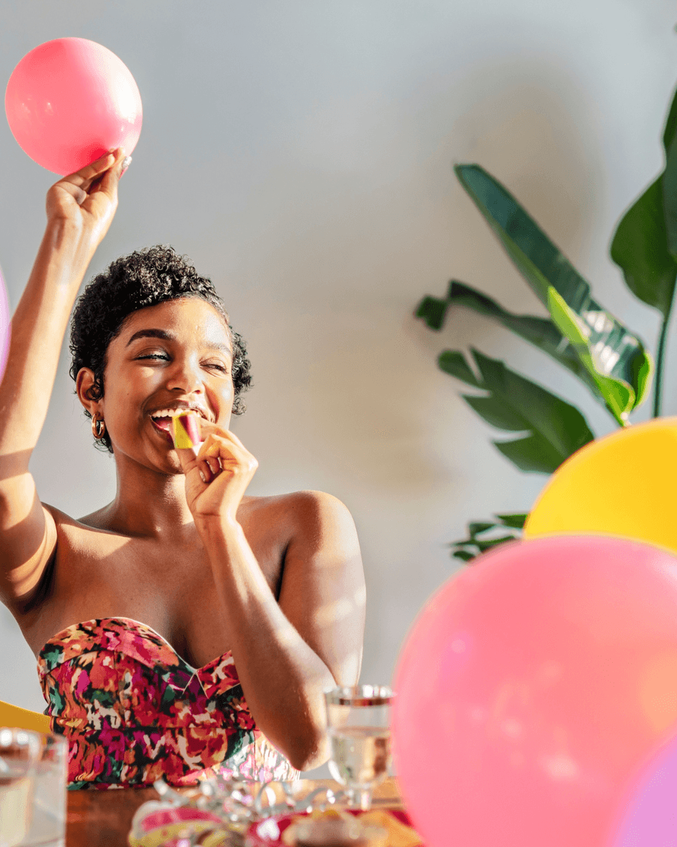Woman celebrating with balloons